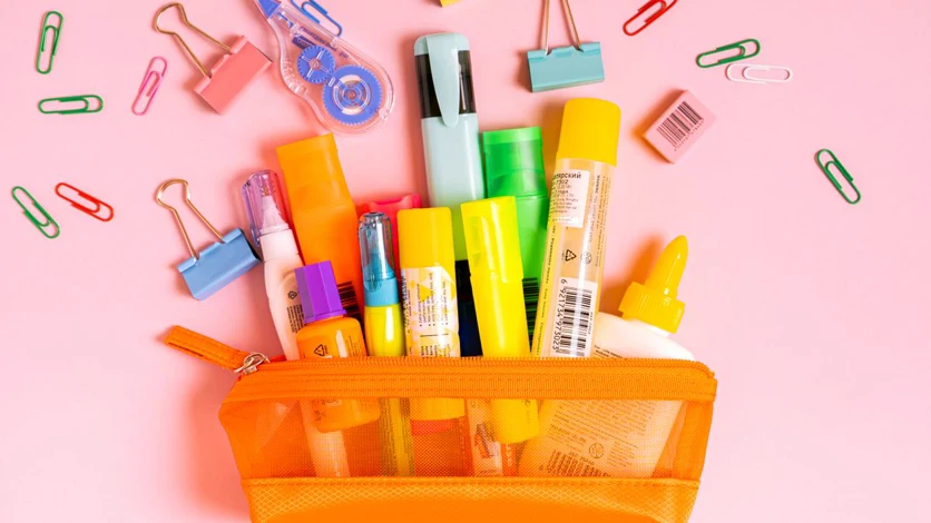 Colourful office stationery arranged on a desk